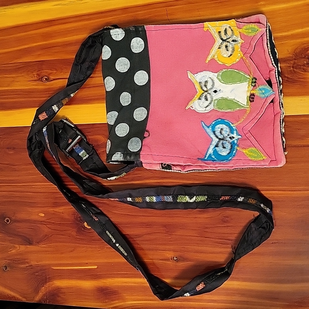 Crossbody purse featuring owls.